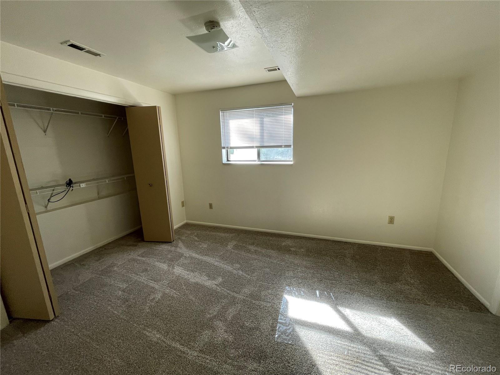 4820 West 88th Place Westminster, CO 80031 - Photo 9 of 21 an empty room with windows
