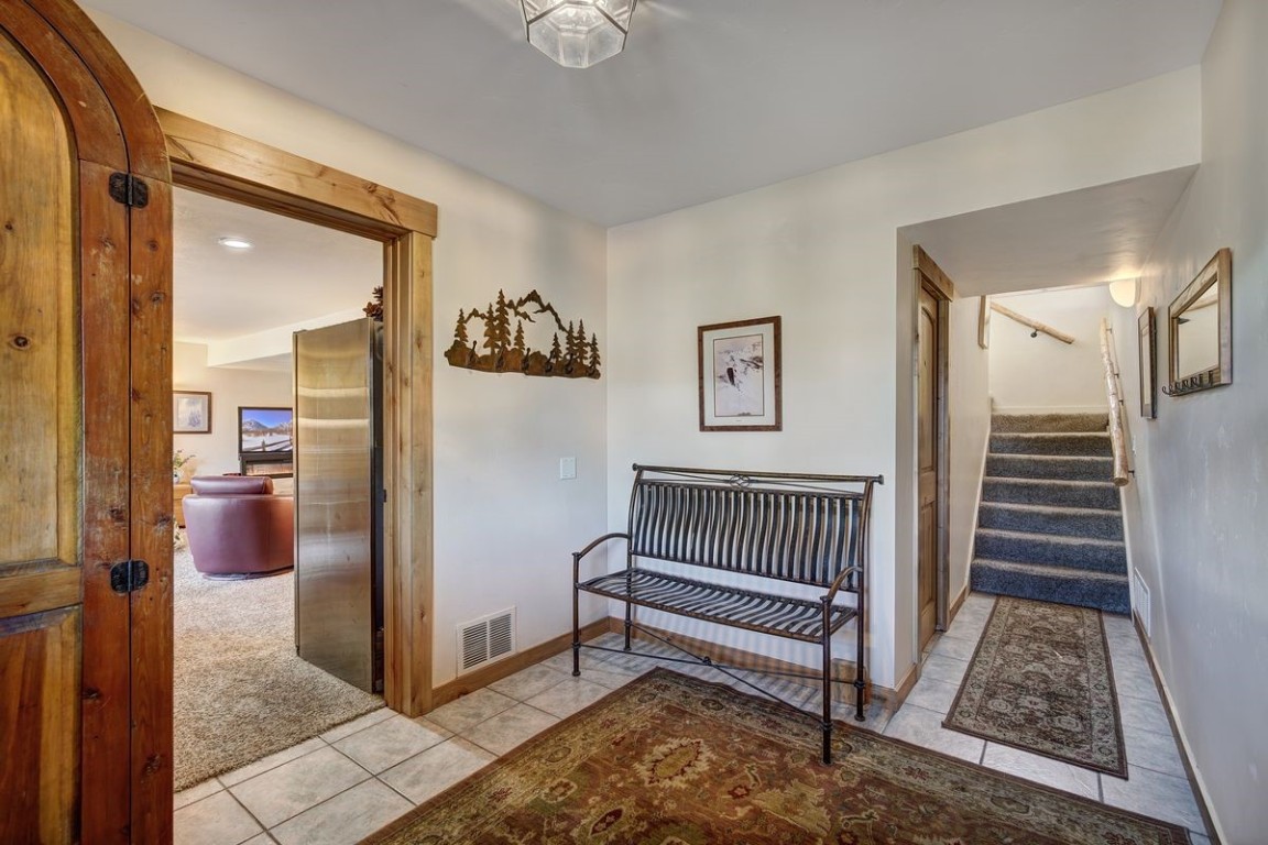 379 Hummingbird Circle Silverthorne, CO 80498 - Photo 21 of 44 a view of entryway with wooden floor and a livingroom