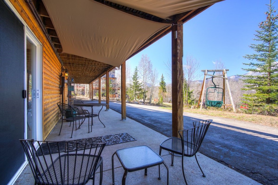 379 Hummingbird Circle Silverthorne, CO 80498 - Photo 29 of 44 a view of a porch with furniture and a yard