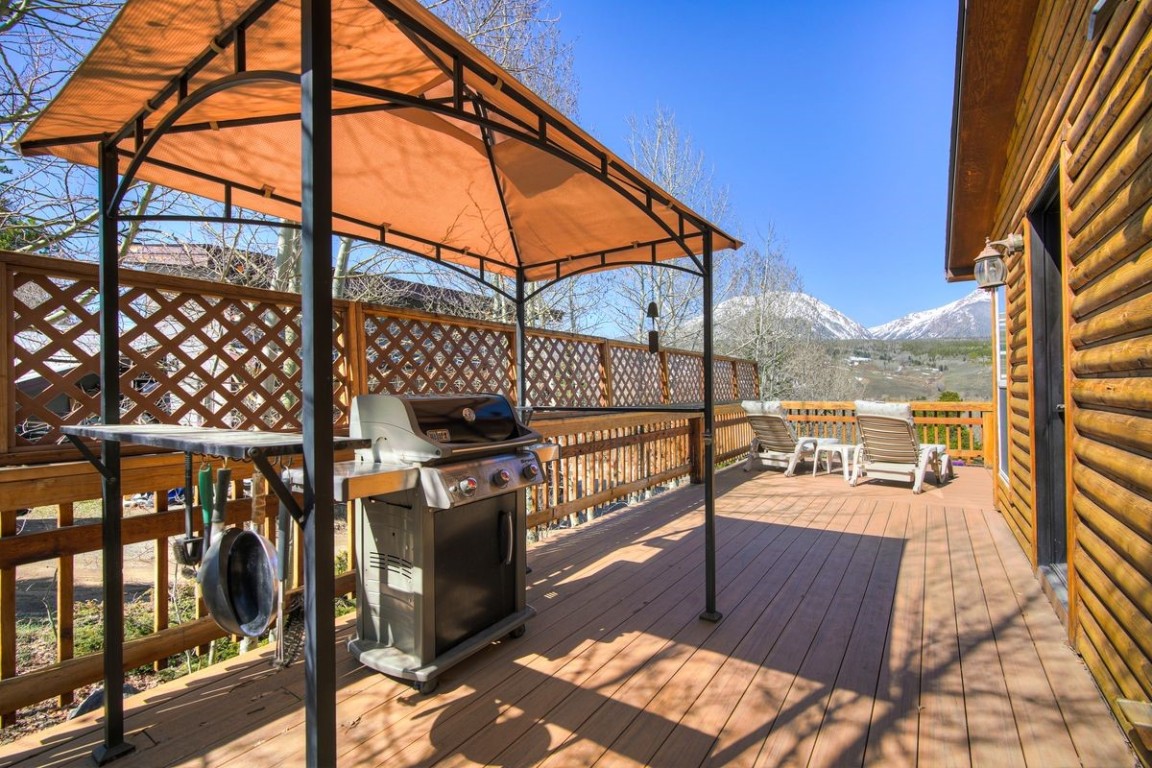 379 Hummingbird Circle Silverthorne, CO 80498 - Photo 31 of 44 a view of a balcony with chairs and wooden fence