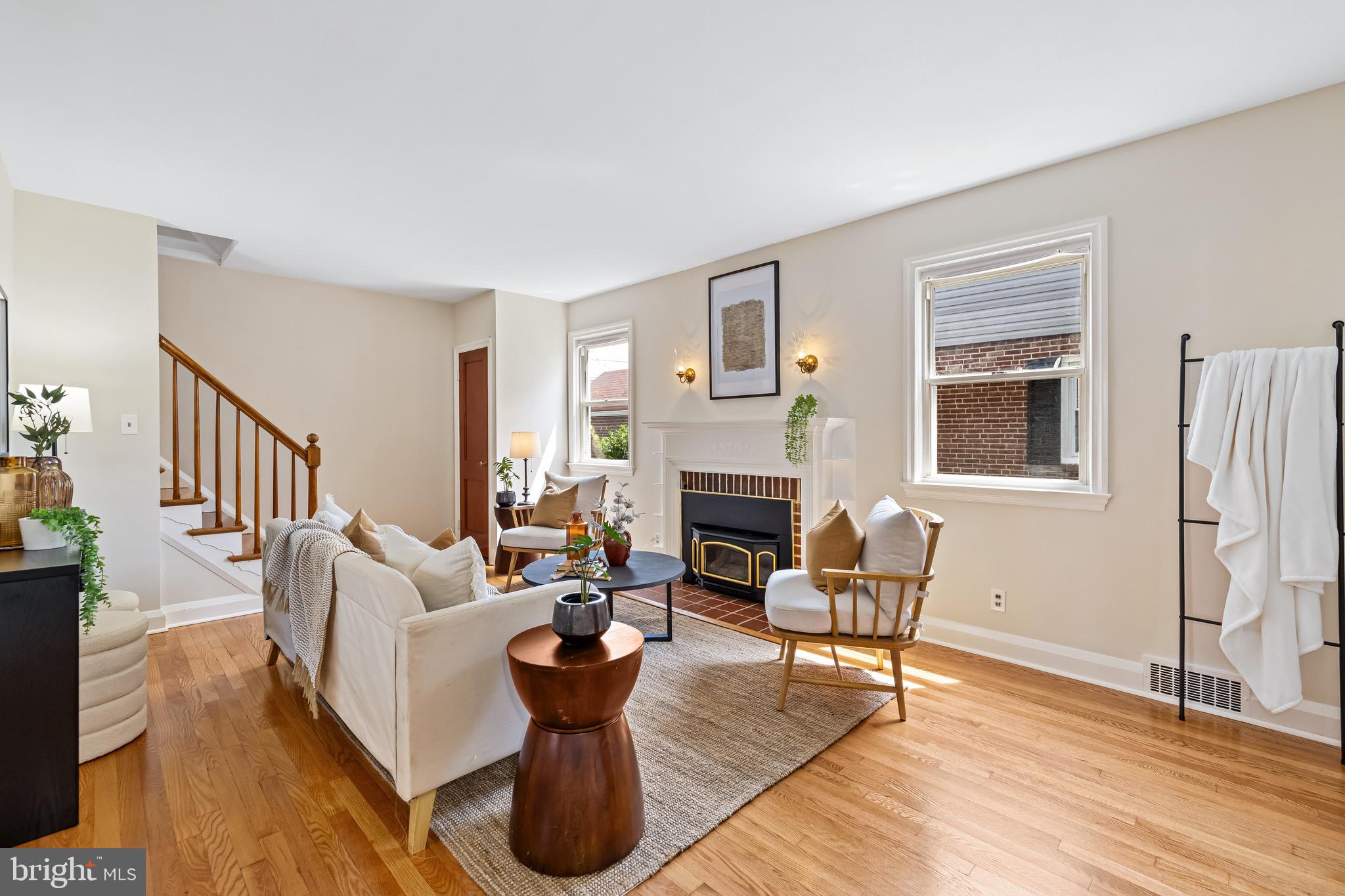 6806 Dunhill Road Baltimore, MD 21222 - Photo 2 of 45 a living room with furniture or couch and a fireplace