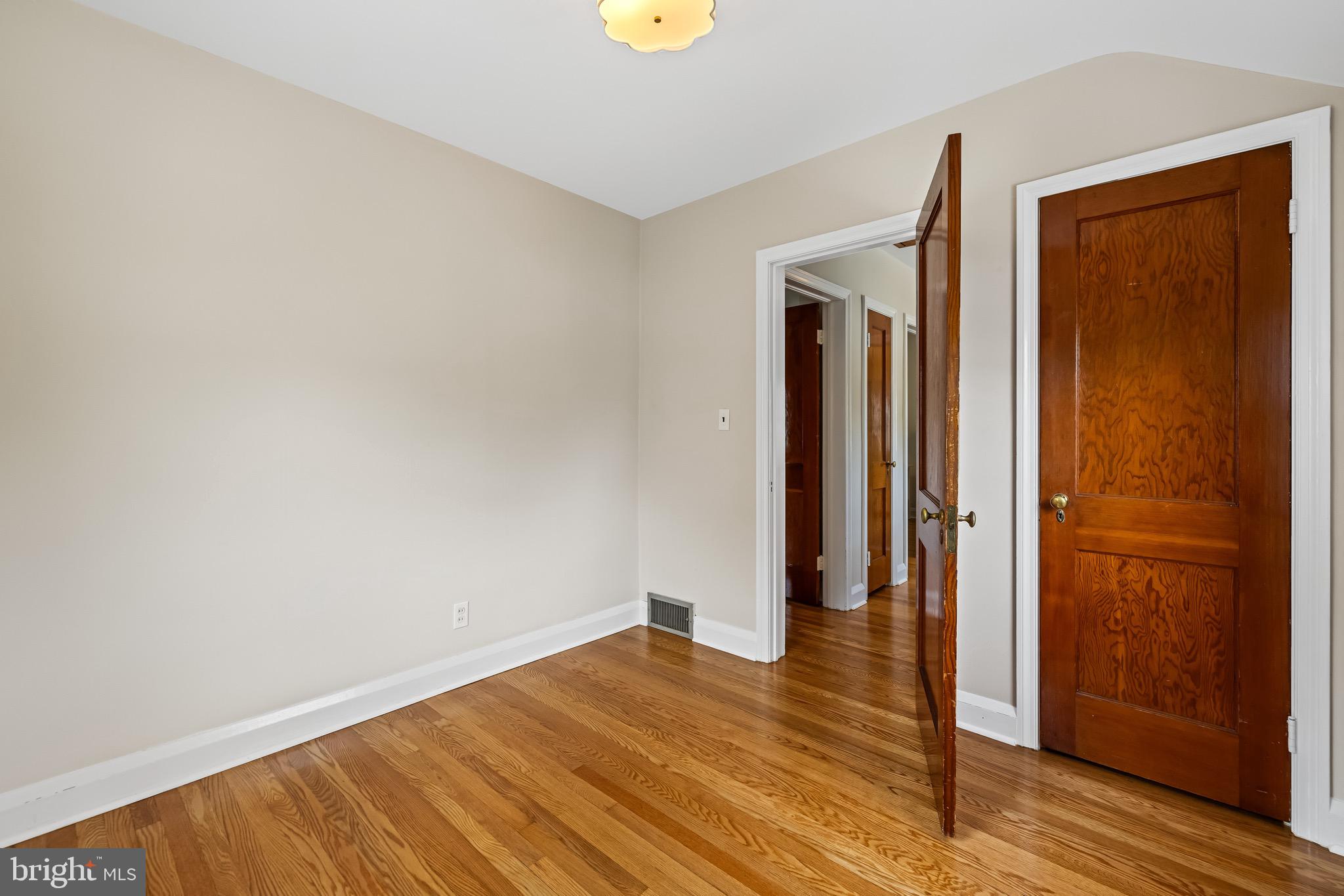 6806 Dunhill Road Baltimore, MD 21222 - Photo 27 of 45 wooden floor in an empty room