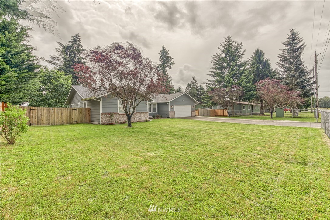 18212 Empire Street Southwest Rochester, WA 98579 - Photo 2 of 29 a house view with swimming pool and wooden fence