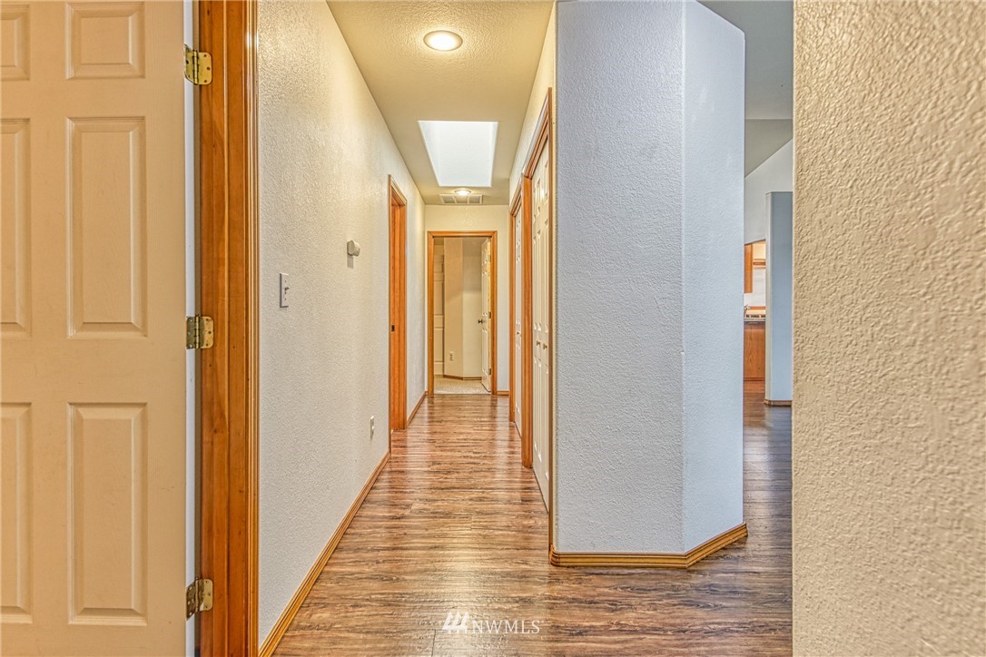 18212 Empire Street Southwest Rochester, WA 98579 - Photo 14 of 29 a view of a hallway with wooden floor