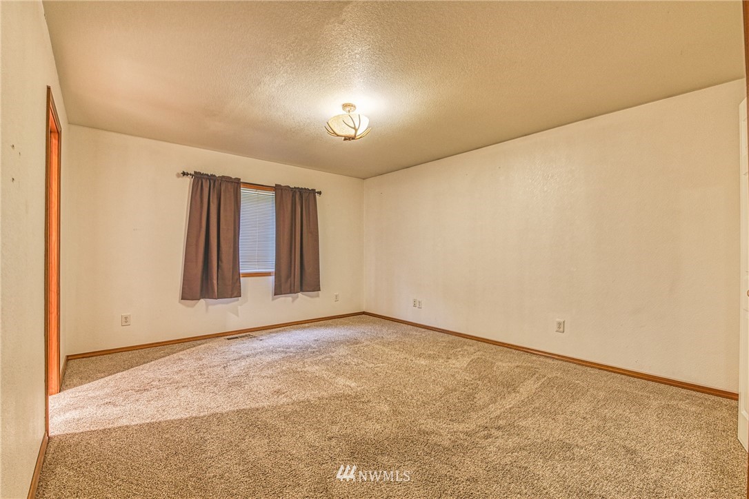 18212 Empire Street Southwest Rochester, WA 98579 - Photo 17 of 29 an empty room with windows
