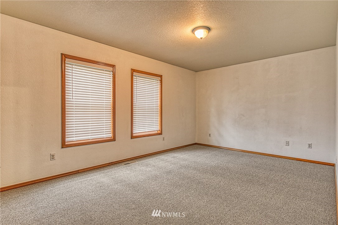 18212 Empire Street Southwest Rochester, WA 98579 - Photo 18 of 29 an empty room with a window