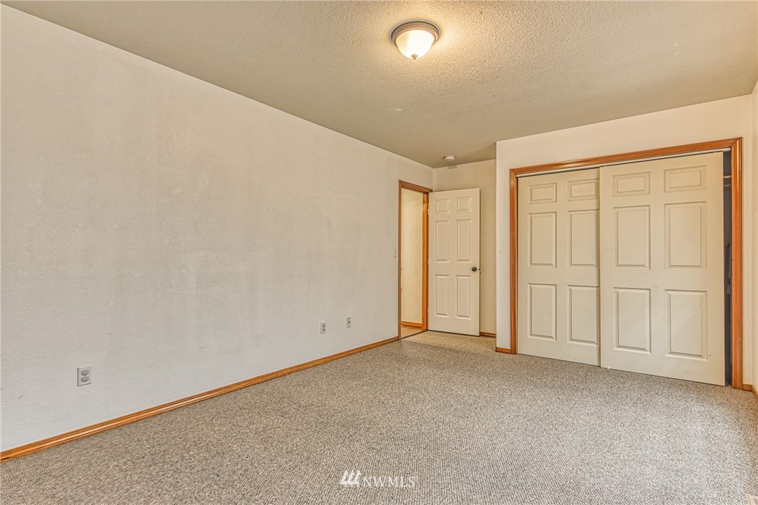 18212 Empire Street Southwest Rochester, WA 98579 - Photo 19 of 29 an empty room with natural light