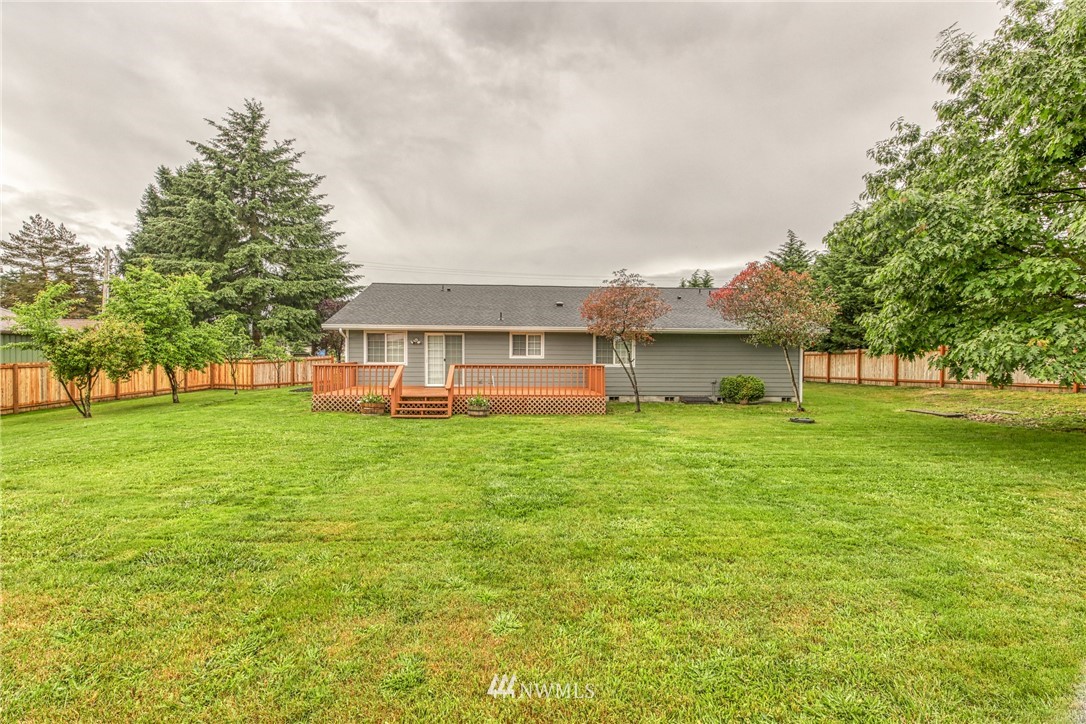 18212 Empire Street Southwest Rochester, WA 98579 - Photo 24 of 29 a view of a house with a big yard and large trees