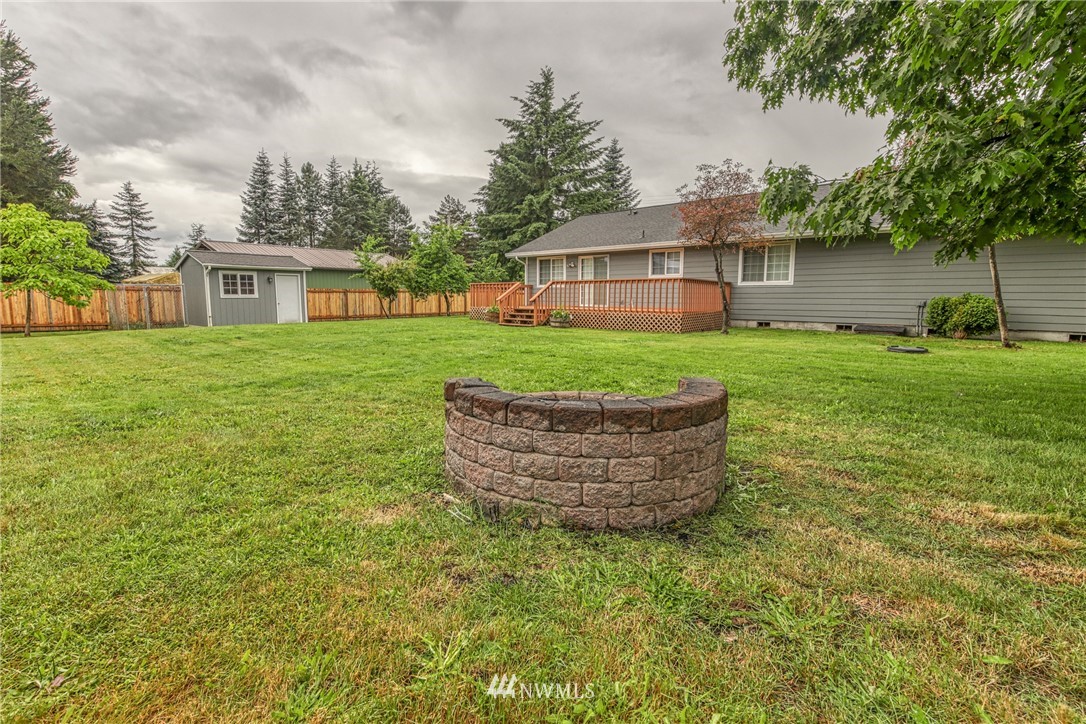 18212 Empire Street Southwest Rochester, WA 98579 - Photo 25 of 29 a front view of a house with a garden