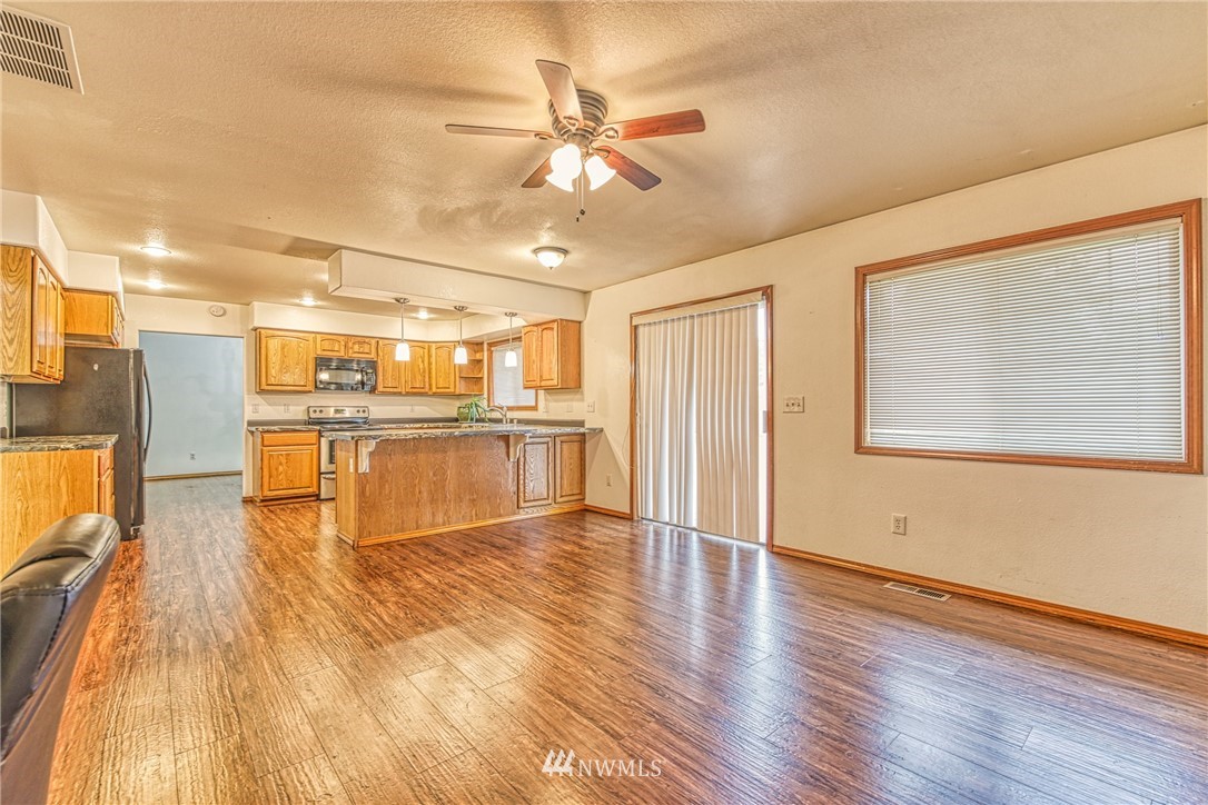 18212 Empire Street Southwest Rochester, WA 98579 - Photo 9 of 29 a view of kitchen with cabinets and wooden floor