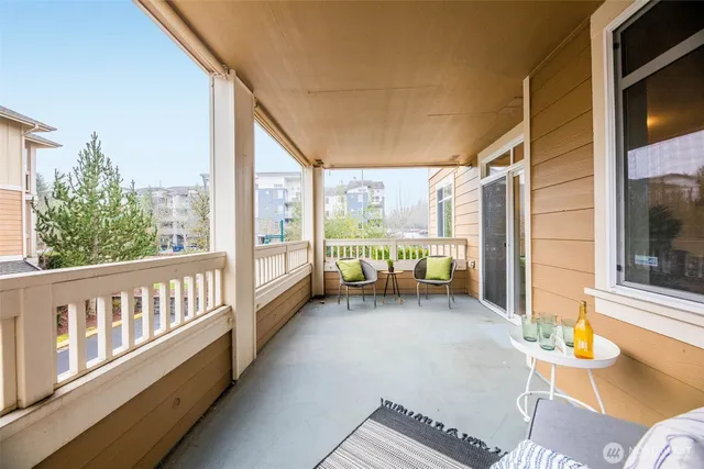 a view of a balcony with chairs