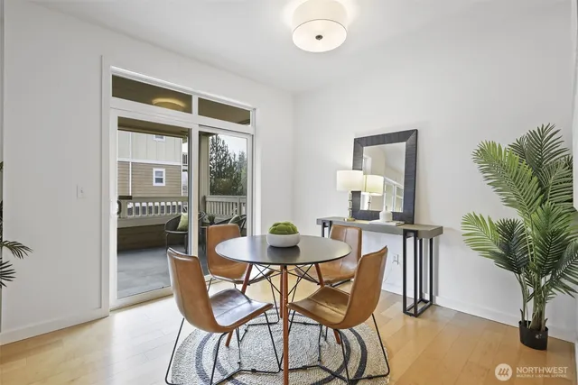 a dining room with furniture and window