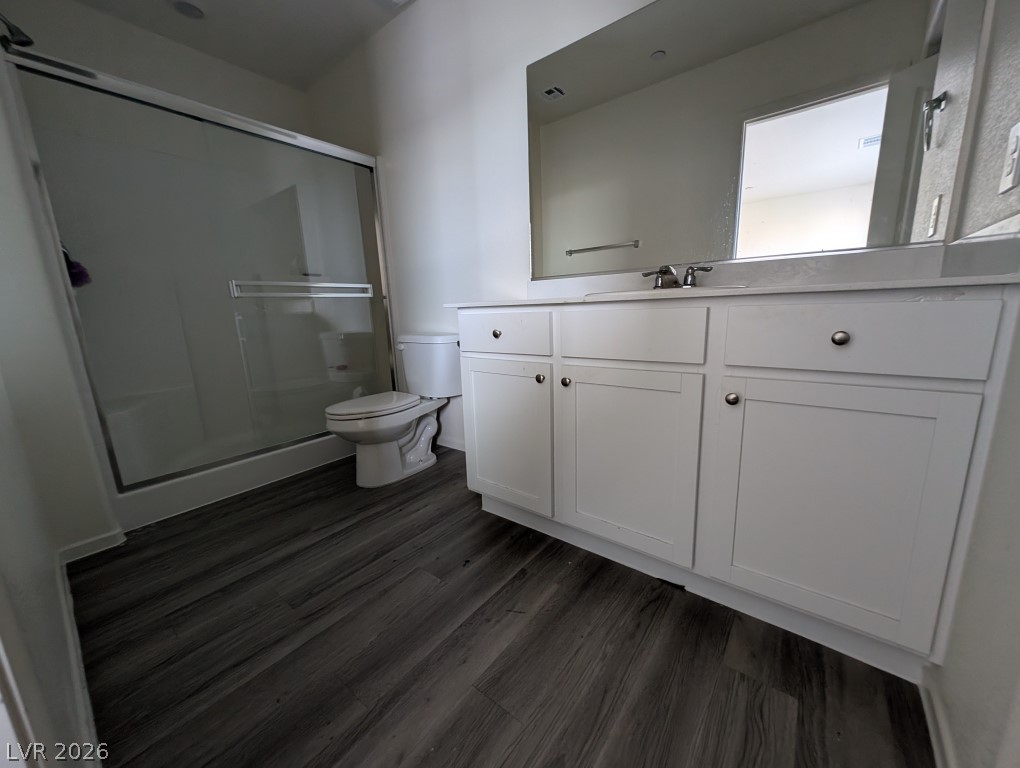 4820 Orchid Rdg Avenue Las Vegas, NV 89141 - Photo 10 of 16 A well-appointed bathroom features a glass-enclosed shower and a crisp white vanity.