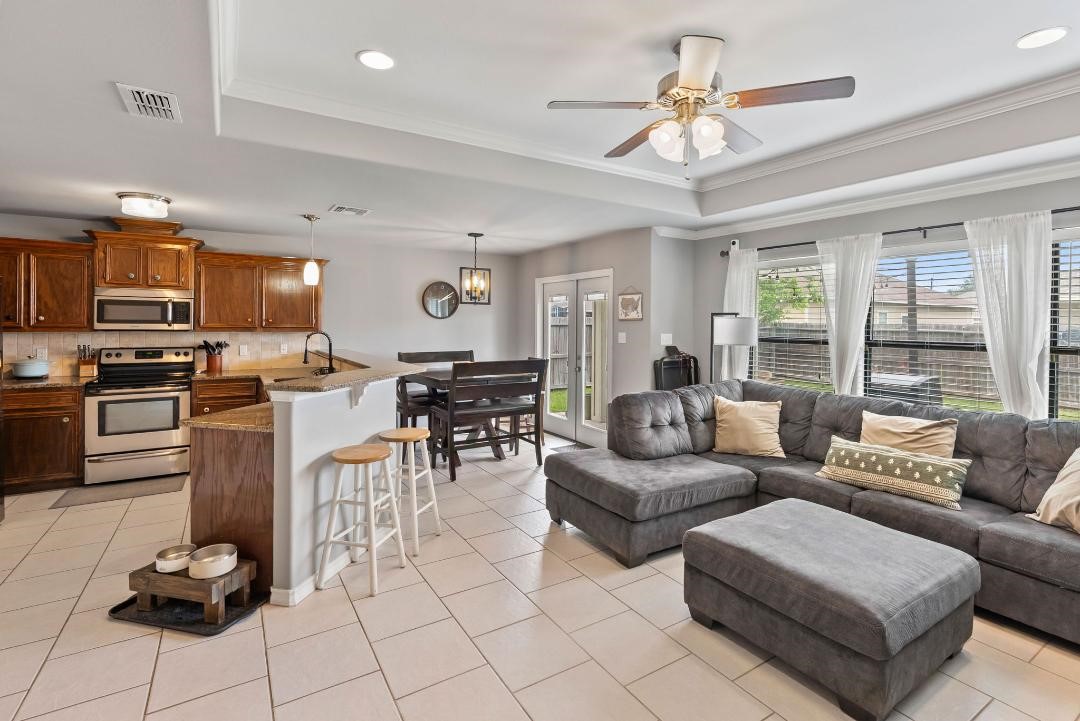 4328 Bratton Road Corpus Christi, TX 78413 - Photo 6 of 24 a living room with furniture kitchen and a chandelier