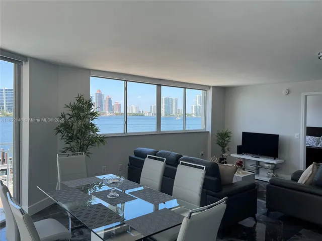 a bedroom with a bed and a night stand