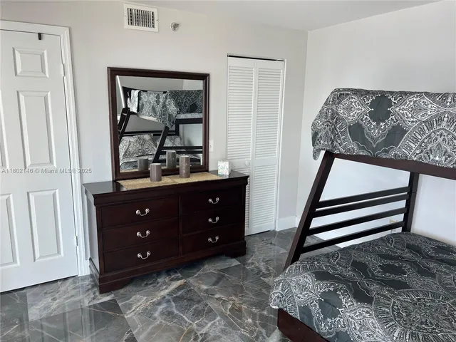 a view of a building with sitting area