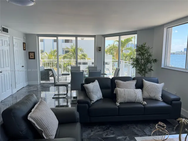 a kitchen with a sink appliances and cabinets