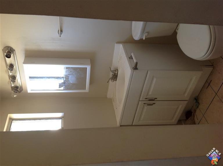 45256 Kingtree Avenue Lancaster, CA 93534 - Photo 8 of 8 a bathroom with a toilet