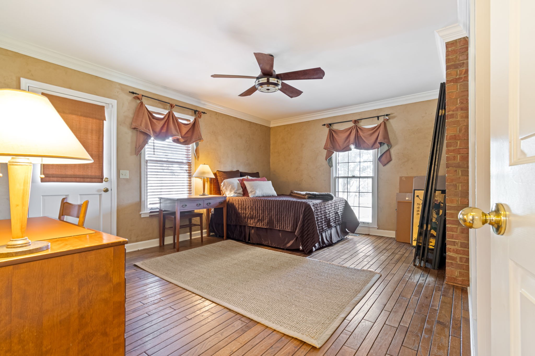6329 Johnson Chapel Road West Brentwood, TN 37027 - Photo 38 of 94 a bedroom with a bed and wooden cabinets