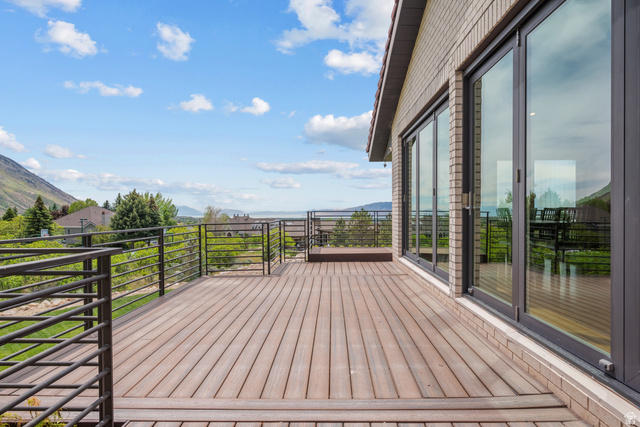 4221 Juniper Circle Alpine, UT 84004 - Photo 50 of 66 Expansive outdoor deck featuring wood-finish composite decking and a multi-pane sliding glass door system