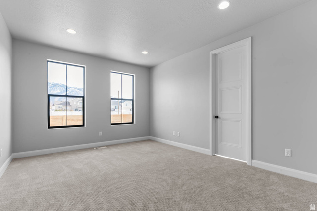 11673 South Halls Crk Road Draper, UT 84020 - Photo 19 of 22 Neutral gray walls define this room featuring light gray carpeting and white baseboards