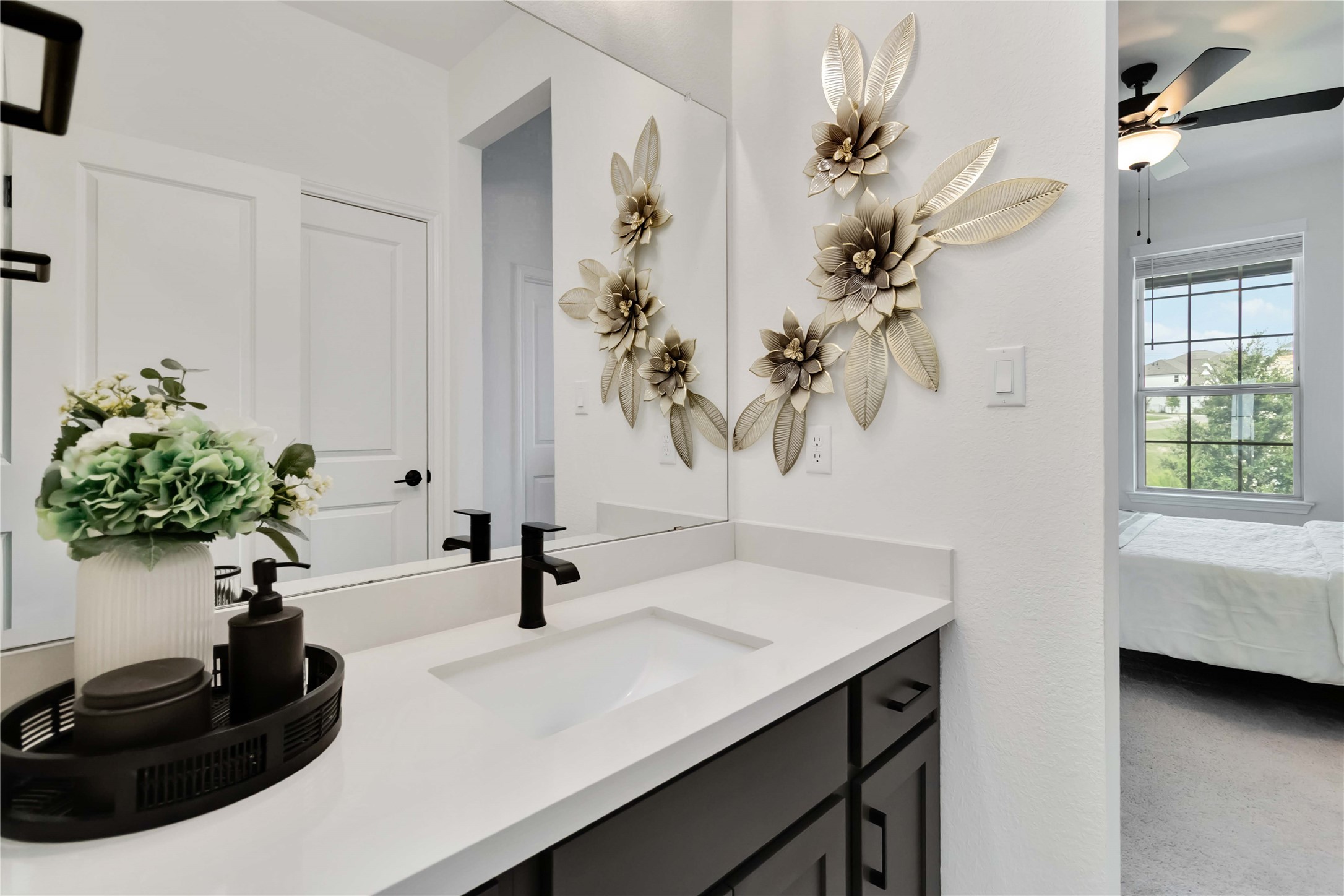 4705 Modena Bay Bend Leander, TX 78641 - Photo 28 of 40 Bathroom with connected bathroom, vanity, and ceiling fan
