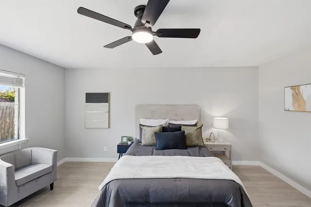 a bedroom with a large bed and a couch