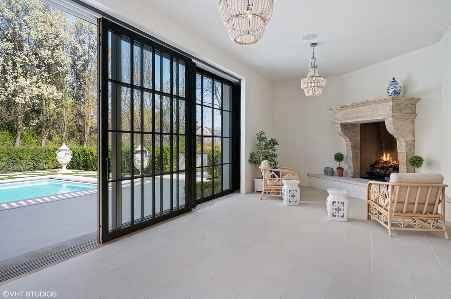 655 Sheridan Road Glencoe, IL 60022 - Photo 21 of 45 a view of a livingroom with furniture hardwood floor and a porch