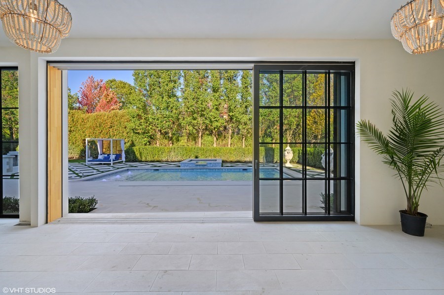 655 Sheridan Road Glencoe, IL 60022 - Photo 22 of 45 a view of porch with a floor to ceiling window and potted plants