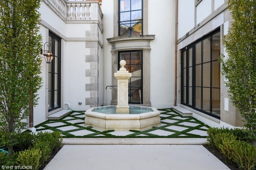 655 Sheridan Road Glencoe, IL 60022 - Photo 26 of 45 a front view of a house with a yard