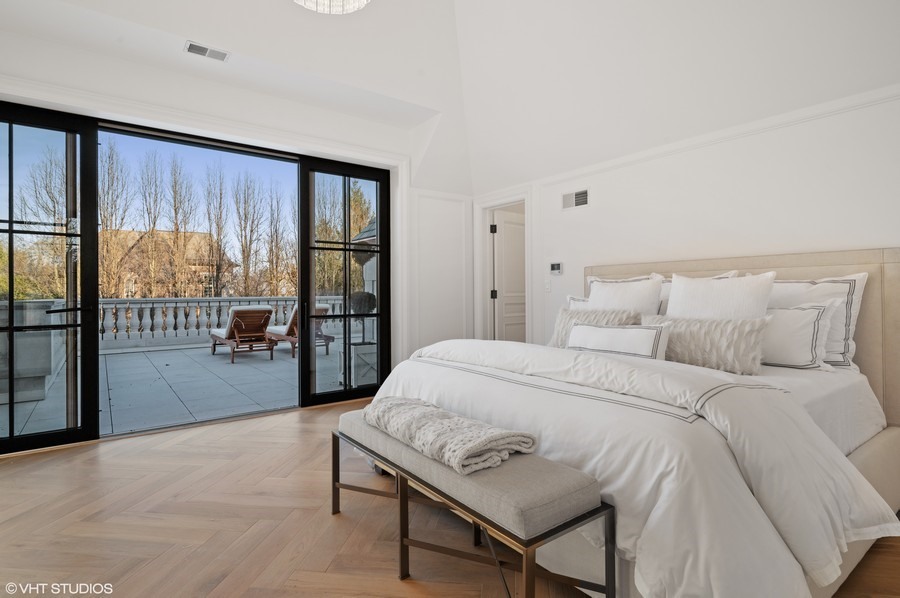 655 Sheridan Road Glencoe, IL 60022 - Photo 30 of 45 a bed room with a bed and a large window