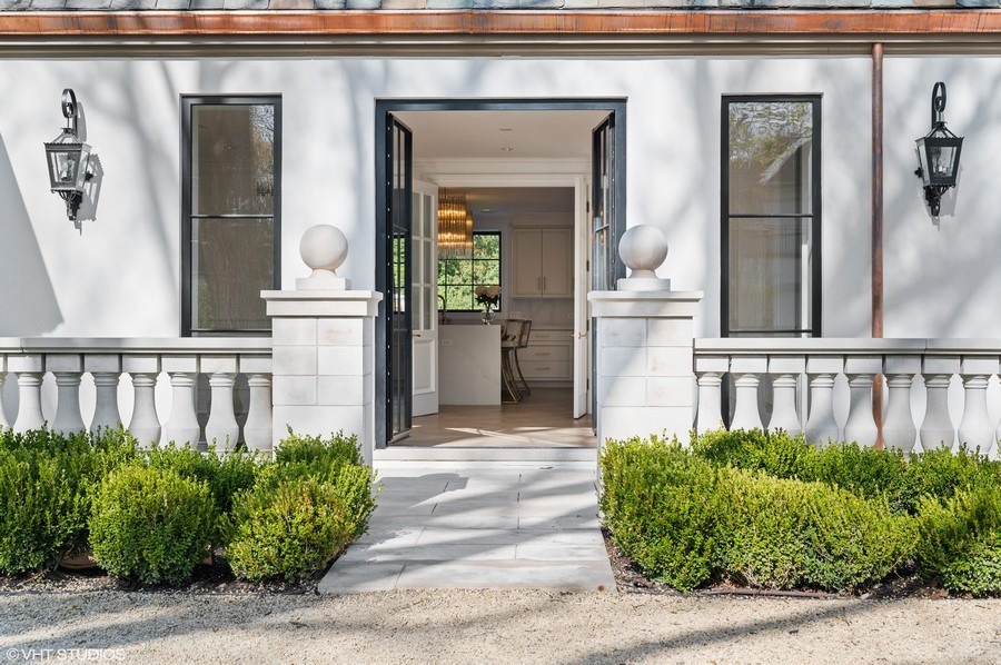 655 Sheridan Road Glencoe, IL 60022 - Photo 7 of 45 a front view of a house with a porch