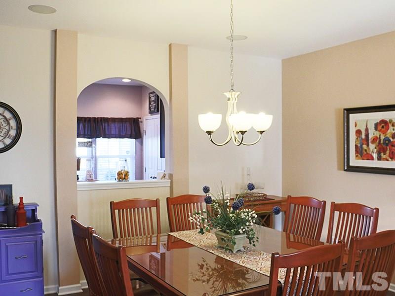 1045 Ileagnes Road Raleigh, NC 27603 - Photo 12 of 22 a view of a dining room with furniture window and wooden floor