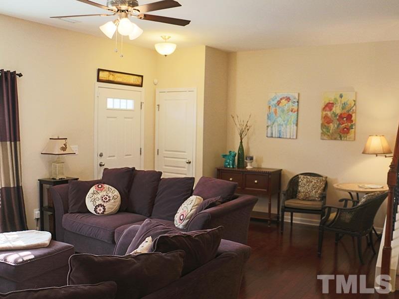 1045 Ileagnes Road Raleigh, NC 27603 - Photo 14 of 22 a living room with furniture and wooden floor