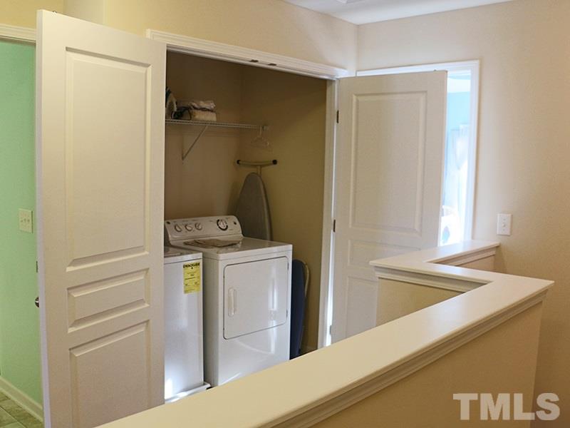 1045 Ileagnes Road Raleigh, NC 27603 - Photo 17 of 22 a bathroom with a bathtub sink and mirror