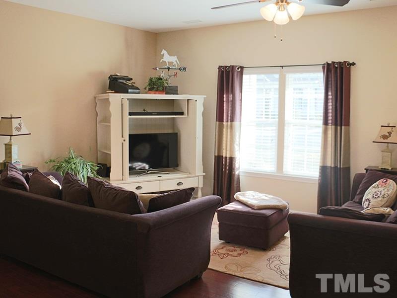 1045 Ileagnes Road Raleigh, NC 27603 - Photo 4 of 22 a living room with furniture and a fireplace