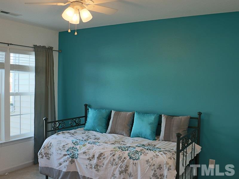 1045 Ileagnes Road Raleigh, NC 27603 - Photo 9 of 22 a bedroom with a bed and window