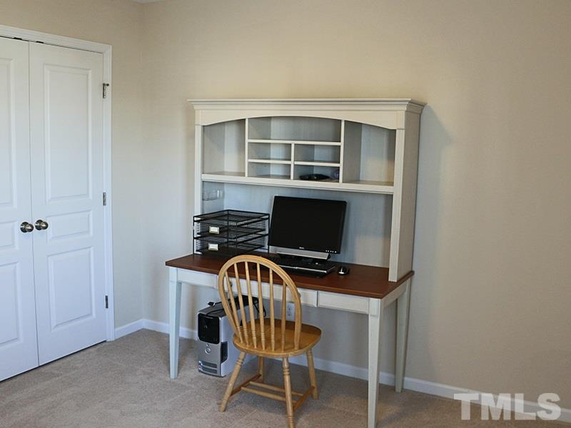 1045 Ileagnes Road Raleigh, NC 27603 - Photo 10 of 22 a workspace with furniture and wooden floor
