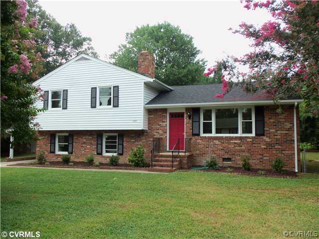 1209 Covington Road Colonial Heights, VA 23834 - Photo 1 of 12 a front view of a house with a yard