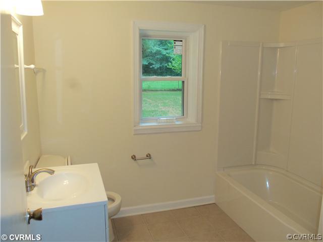 1209 Covington Road Colonial Heights, VA 23834 - Photo 8 of 12 a bathroom with a sink and a bathtub