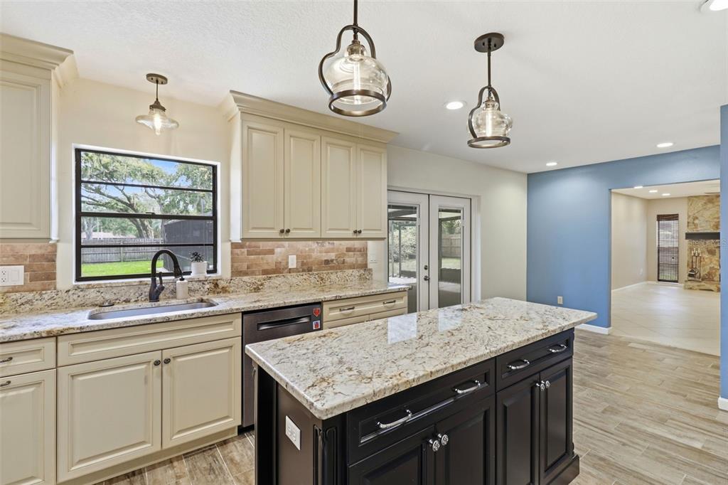 302 Bloomingfield Drive Brandon, FL 33511 - Photo 16 of 58 a kitchen with center island and stainless steel appliances