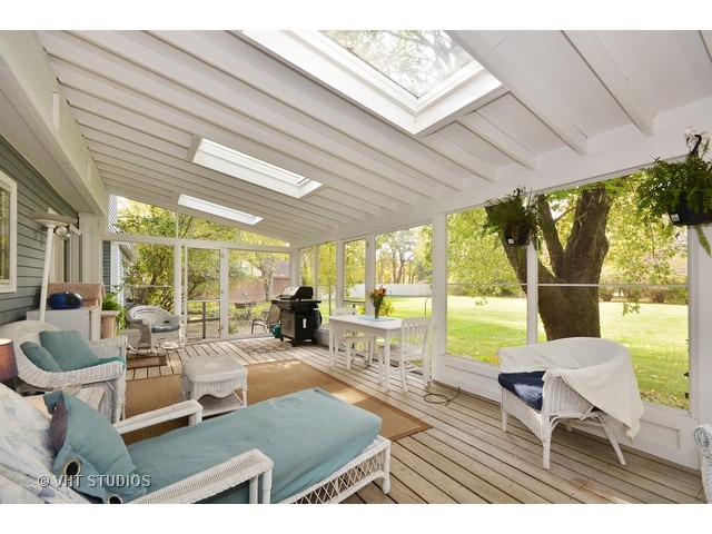 5N316 Oak Road St. Charles, IL 60175 - Photo 13 of 25 a living room with patio furniture and a large window