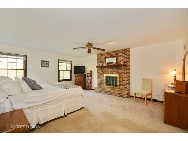5N316 Oak Road St. Charles, IL 60175 - Photo 14 of 25 a bed room with a bed furniture and a flat screen tv