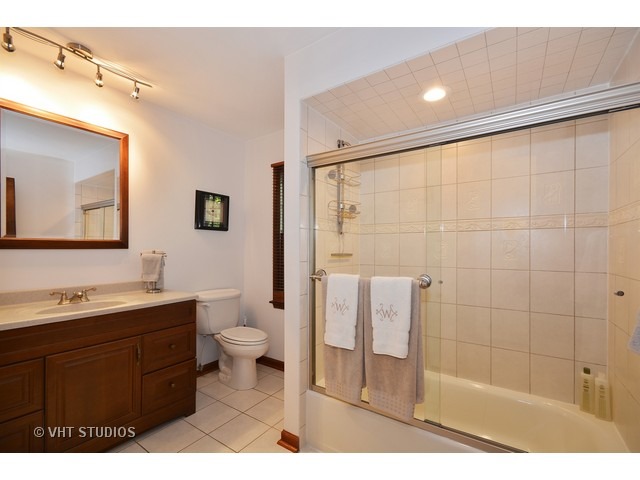 5N316 Oak Road St. Charles, IL 60175 - Photo 16 of 25 a bathroom with a sink a toilet and shower