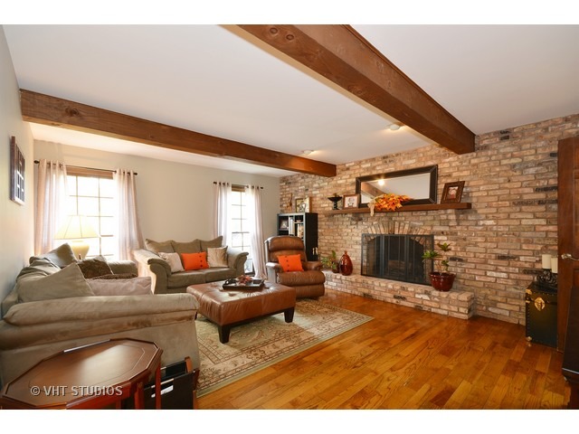 5N316 Oak Road St. Charles, IL 60175 - Photo 3 of 25 a living room with fireplace furniture and a large window
