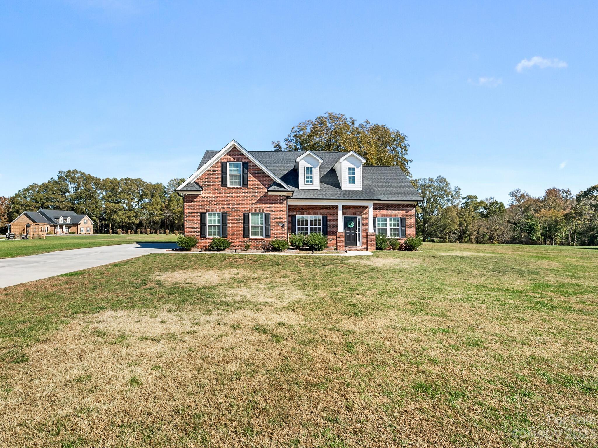 3324 Sincerity Road Monroe, NC 28110 - Photo 1 of 24 a front view of a house with a yard