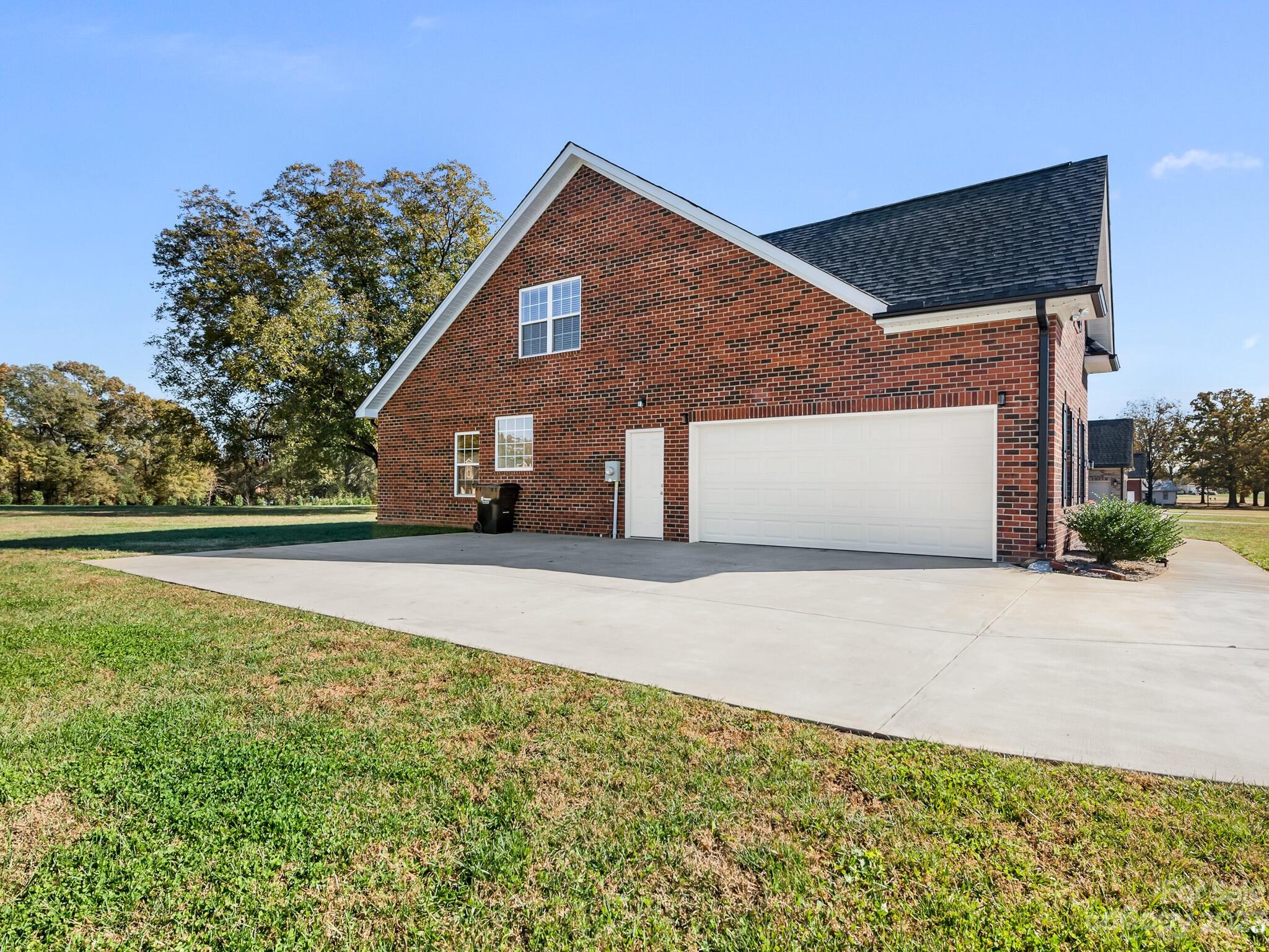 3324 Sincerity Road Monroe, NC 28110 - Photo 23 of 24 a front view of a house with a yard and garage