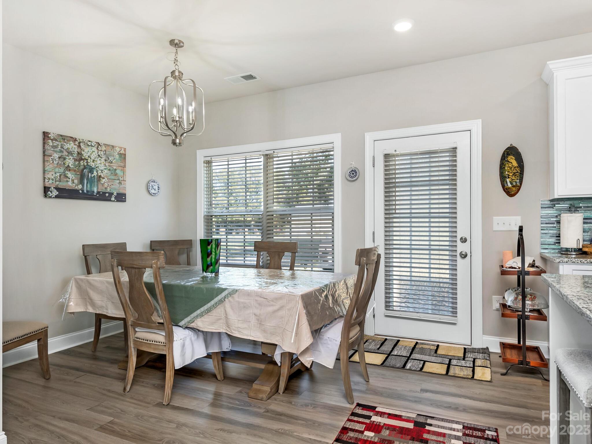 3324 Sincerity Road Monroe, NC 28110 - Photo 8 of 24 a view of a dining room with furniture window and wooden floor