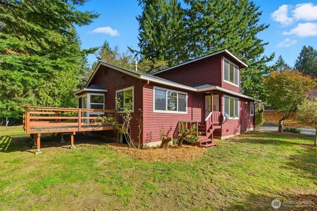 a view of a house with a yard porch and sitting area