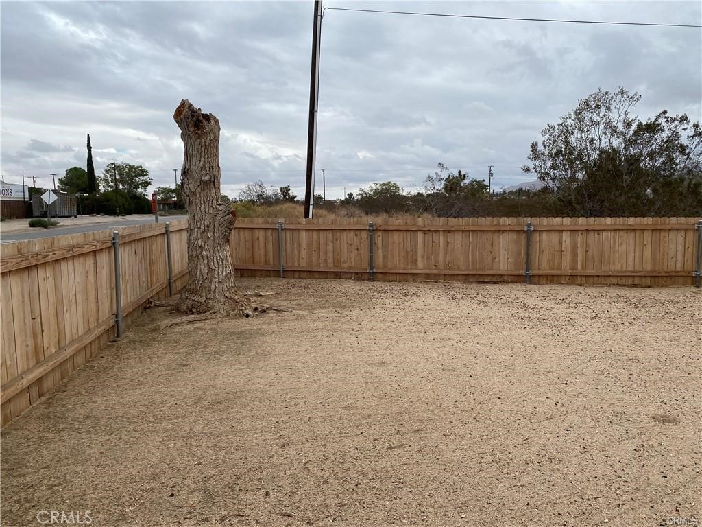 55897 Santa Fe Trail Yucca Valley, CA 92284 - Photo 2 of 4 a view of a backyard